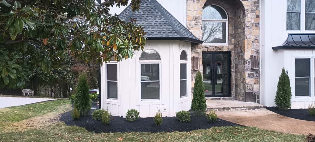 Stone entrance with irrigation and landscape design