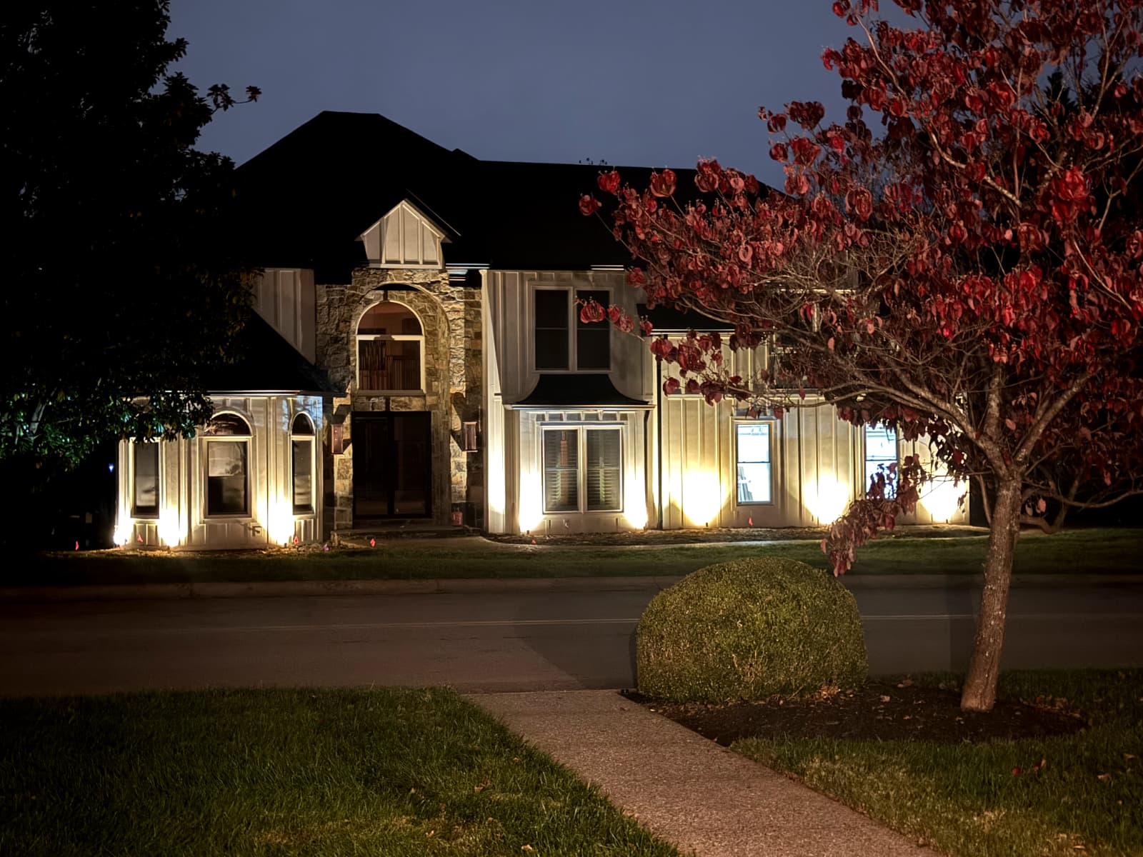 Professional landscape lighting installation on luxury home in Knoxville
